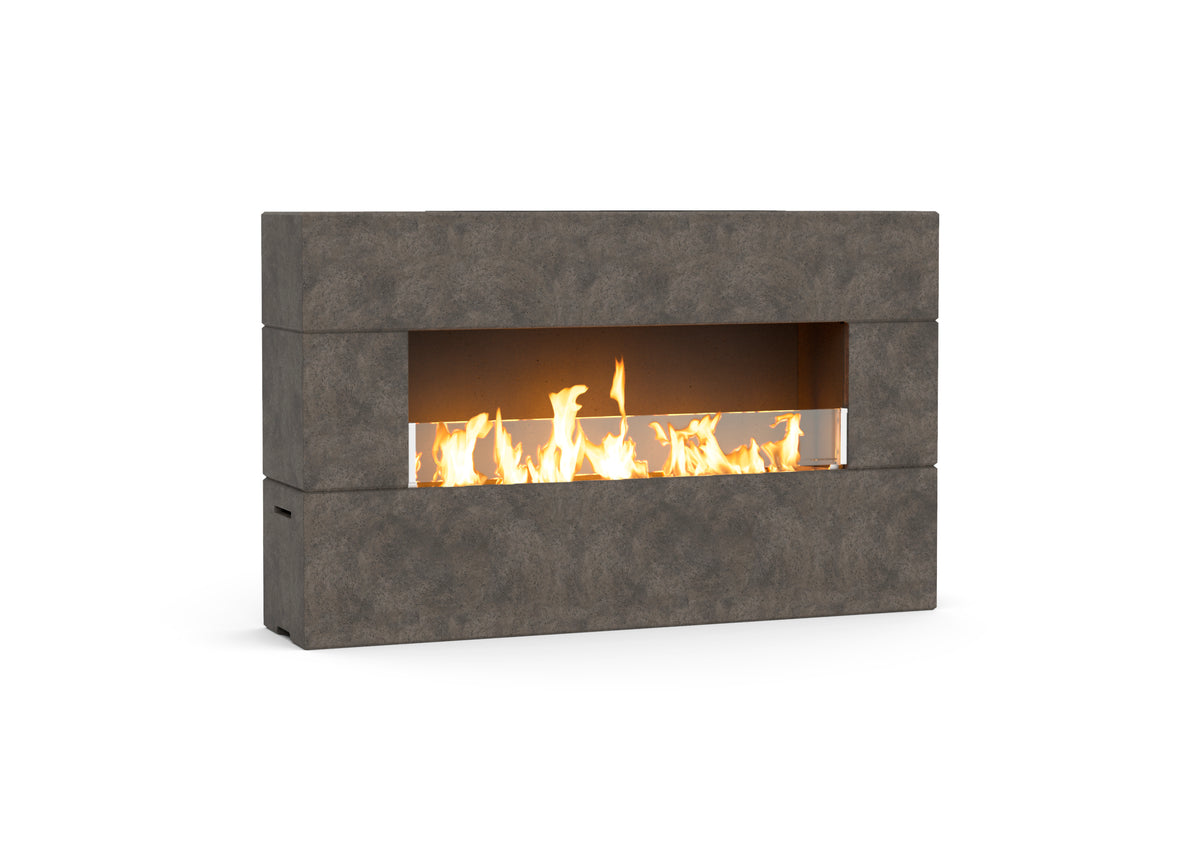 American Fyre Designs Milan Low 211-LO outdoor fireplace in Dark Basalt, manual-control family photograph; decorative media shown sold separately